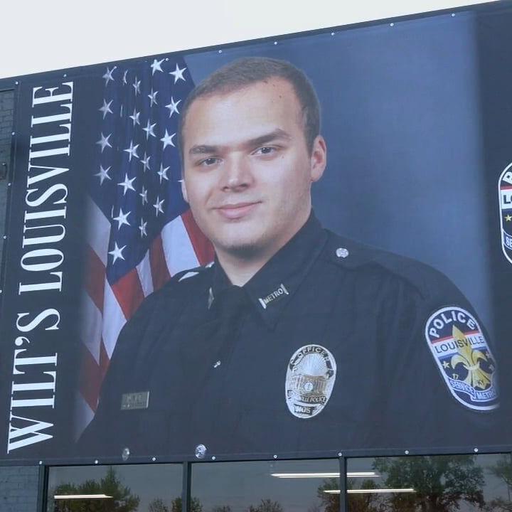 Banner honoring LMPD Ofc. Nick Wilt unveiled on Louisville building
